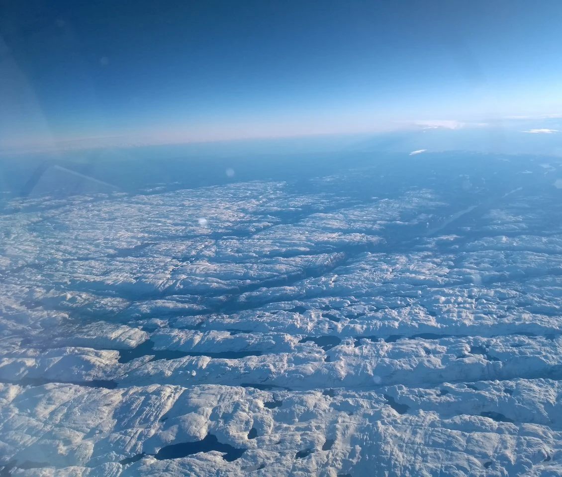 Snow-covered Norwegian mountains stretching into the distance